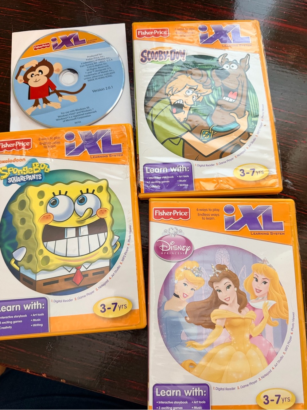 Five Fisher Price iXL learning system games (DVDs) ages 3-7